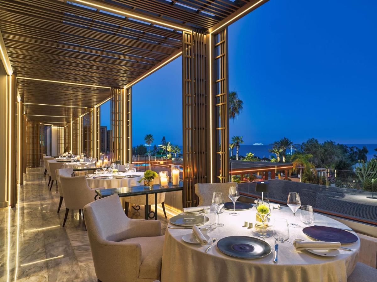 Four Seasons Hotel Agios Tychonas Exteriör bild The restaurant at the hotel